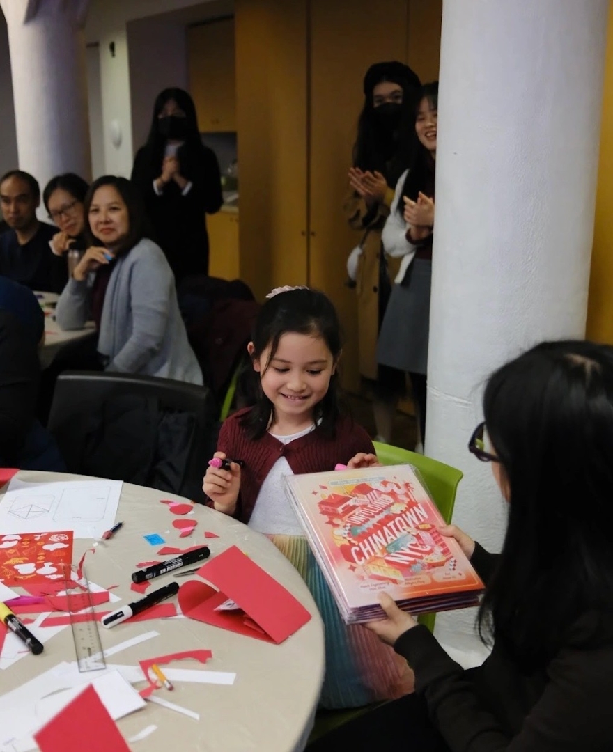 Copies of Unfolding Chinatown NYC: A Pop-up Journey Through Times. were distributed to visitors as part of programs hosted in collaboration with the Museum of Chinese in America. Image courtesy of MOCA.