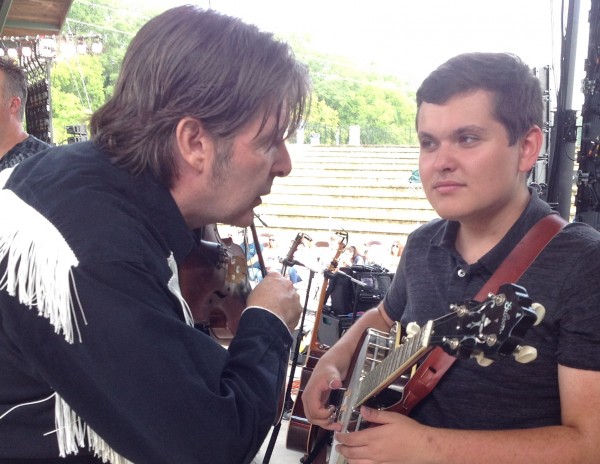 Randall Franks coaches Share America Scholar Trevor Holder backstage.