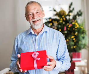 Elderly man giving a retirement gift