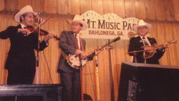 Randall Franks (left) plays Back Up and Push with Bill Monroe (right) and Blake Williams at the Dahlonega Bluegrass Festival in June 1984. (Randall Franks Media: Betty Needham)